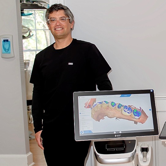 Doctor Graber displaying patient's smile impressions on chairside computer