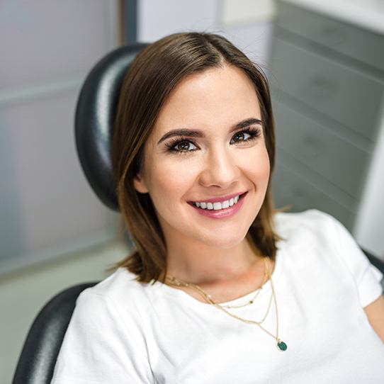 Smiling woman at preventive dentistry checkup visit