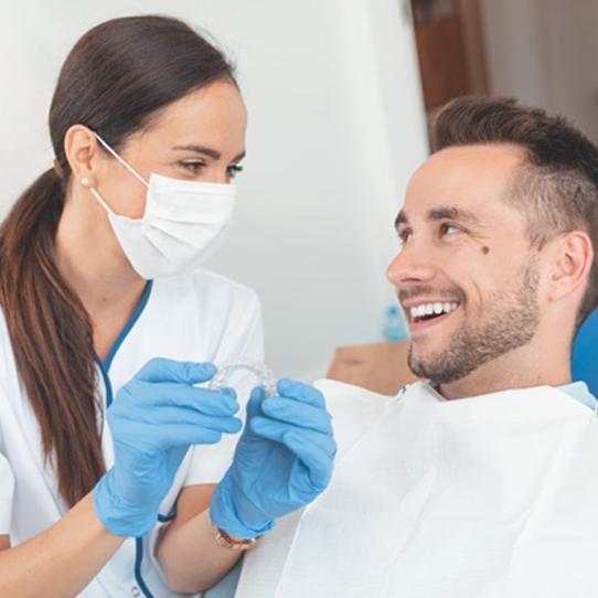 Shelton dentist and patient discussing Invisalign